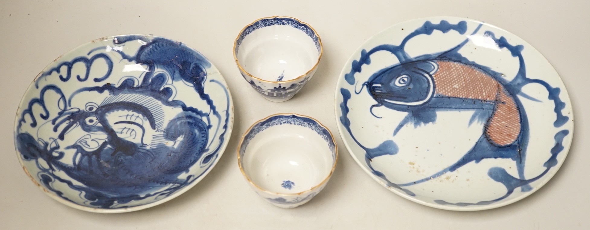 Two 19th century Chinese blue and white dishes and two 18th century tea bowls, largest 23cm diameter
